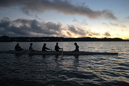 The St. John's Crew team rows in the Severn River before sunrise.