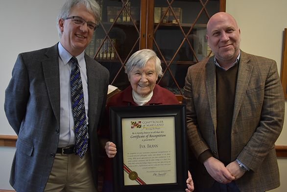 Eva Brann holds award