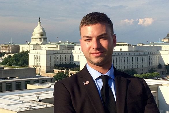 Tyler Mazur (A20) poses for a photo in front of the U.S. Capitol.