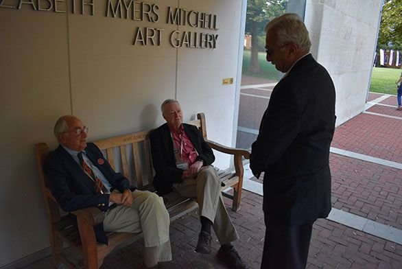 Allan Hoffman, left, Steve Benedict and Nick Maistrellis converse outside of The Mitchell Gallery.