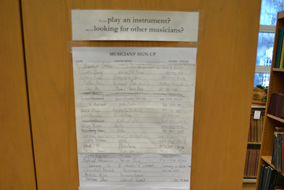 A sign-up sheet hangs in the music library.