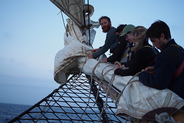 Mary Christman (second from top) works hard during the trans-Atlantic voyage.