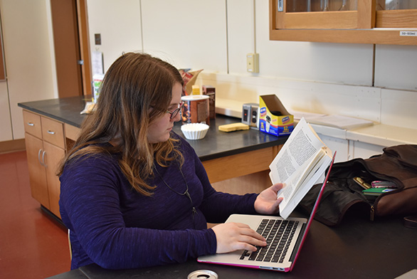 Jessica Benya works on her senior essay in Mellon Hall.