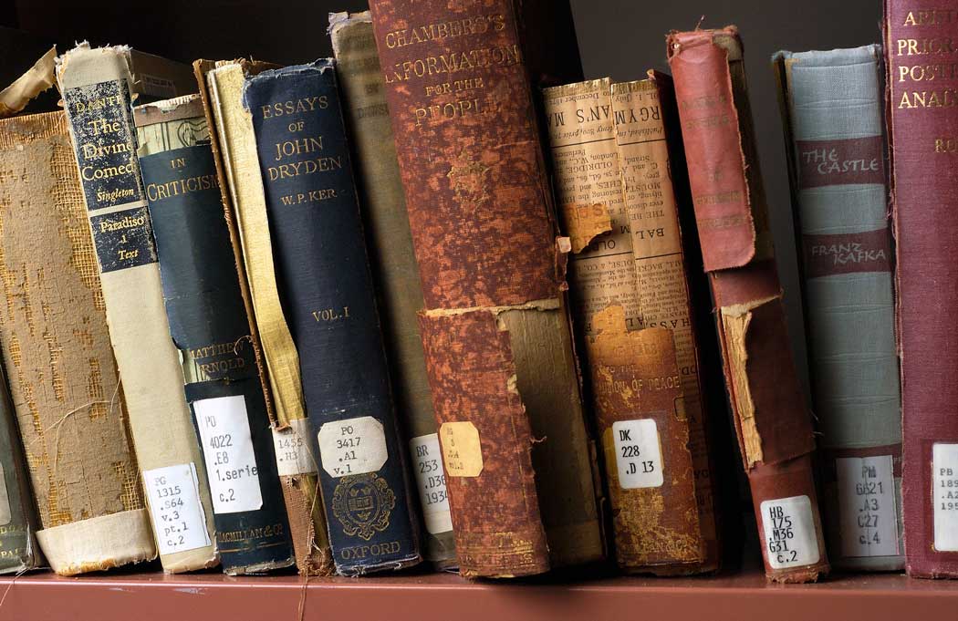 Program books on library shelf