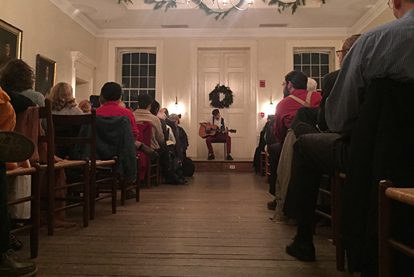 Barnabas Holleran plays the guitar during the winter Collegium.