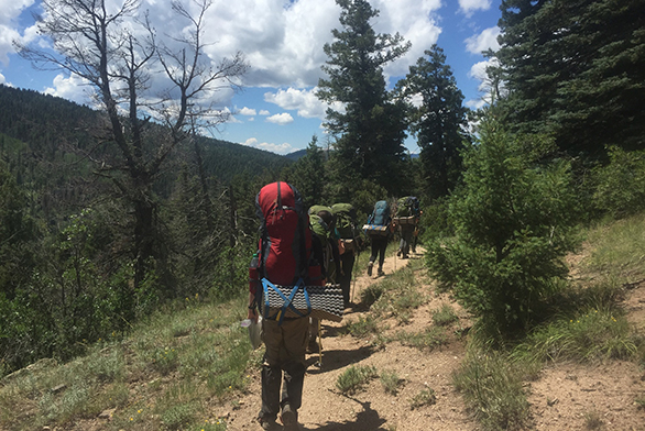 Students backpack through the mountains.