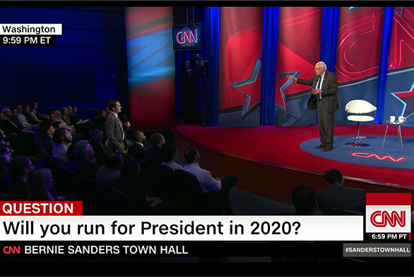 Neale listens as Sanders addresses his question at the CNN Town Hall.