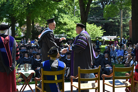 More than 100 St. John's graduates shook the hand of outgoing President Chris Nelson at Commencement on May 14.