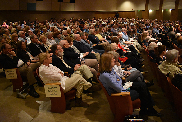 Audience members listen to Brokaw and Mullen.