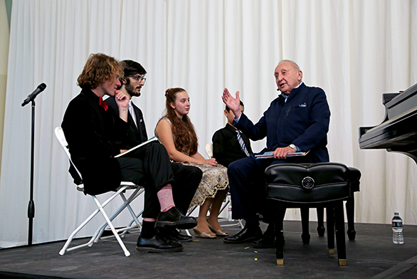 St. John's students Evan Quarles and Jack Mooradian (left) work with Seymour Bernstein (right) during a master class in Santa Fe.