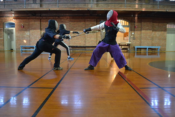The HEMA club practices techniques in Iglehart Gymnasium.