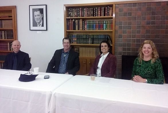 Members of the panel pose for a photo.