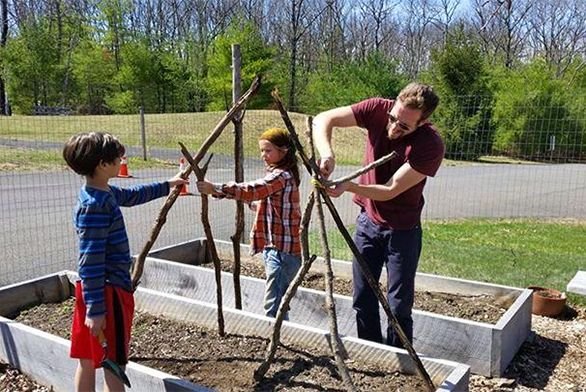 Matt Gioia works with students