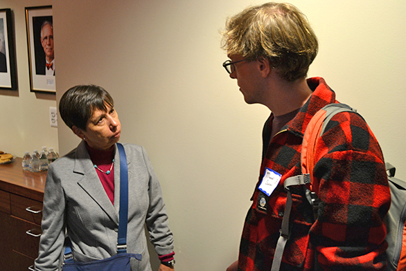 Linda Bernstein speaks with a student after the group disperses.