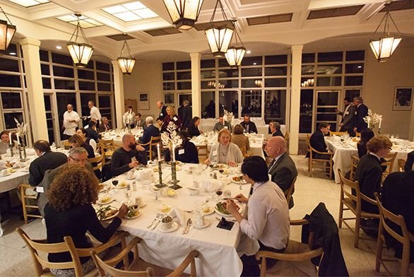 Students and board members eat dinner