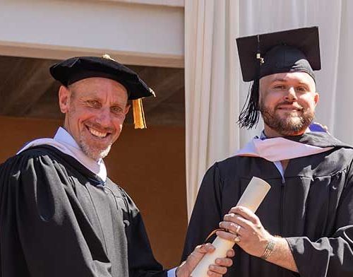 Alex Clark (EC24) and J. Walter Sterling at Santa Fe Commencement